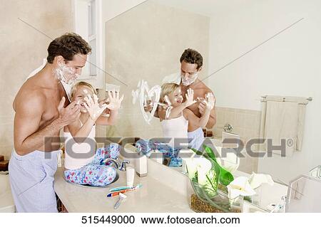 Girl playing with her father in the bathroom View Large Photo Image Stock Image - Girl playing with her father in the bathroom. Fotosearch
