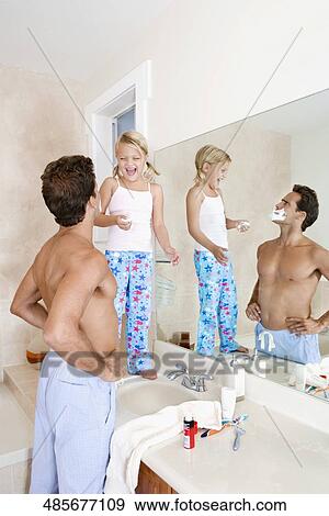 Girl playing with her father in the bathroom View Large Photo Image Stock Photo - Girl playing with her father in the bathroom. Fotosearch