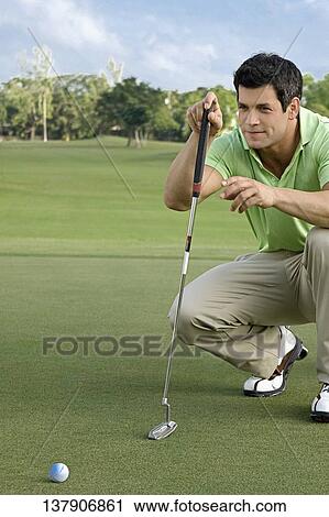 Golfer playing golf in a golf course, Biltmore Golf Course, Coral Gables, Florida, USA View Large Photo Image Stock Image - Golfer playing golf in a golf course, Biltmore Golf Course, Coral Gables, Florida, USA. Fotosearch