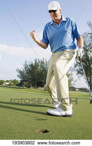 Golfer playing golf in a golf course, Biltmore Golf Course, Coral Gables, Florida, USA View Large Photo Image Stock Image - Golfer playing golf in a golf course, Biltmore Golf Course, Coral Gables, Florida, USA. Fotosearch