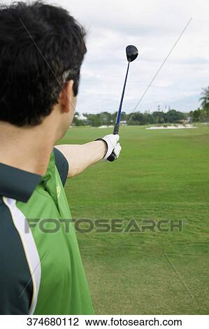 Golfer playing golf in a golf course, Biltmore Golf Course, Coral Gables, Florida, USA View Large Photo Image Stock Image - Golfer playing golf in a golf course, Biltmore Golf Course, Coral Gables, Florida, USA. Fotosearch