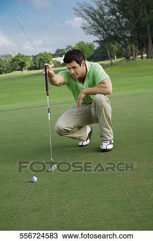 Golfer playing golf in a golf course, Biltmore Golf Course, Coral Gables, Florida, USA View Large Photo Image Stock Image - Golfer playing golf in a golf course, Biltmore Golf Course, Coral Gables, Florida, USA. Fotosearch