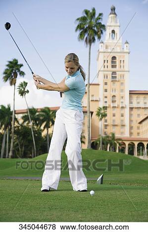Golfer playing golf in a golf course, Biltmore Golf Course, Biltmore Hotel, Coral Gables, Florida, USA View Large Photo Image Stock Photo - Golfer playing golf in a golf course, Biltmore Golf Course, Biltmore Hotel, Coral Gables, Florida, USA. Fotosearch