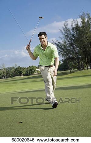 Golfer playing golf in a golf course and smiling, Biltmore Golf Course, Coral Gables, Florida, USA View Large Photo Image Stock Photograph - Golfer playing golf in a golf course and smiling, Biltmore Golf Course, Coral Gables, Florida, USA. Fotosearch