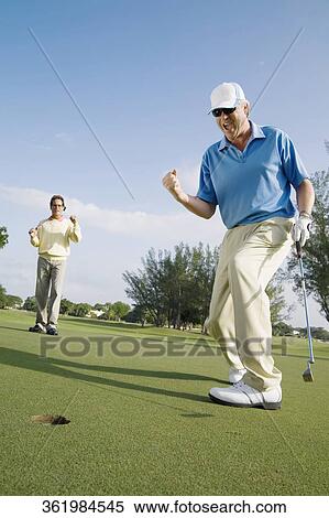 Golfer playing golf in a golf course, Biltmore Golf Course, Coral Gables, Florida, USA View Large Photo Image Stock Photography - Golfer playing golf in a golf course, Biltmore Golf Course, Coral Gables, Florida, USA. Fotosearch