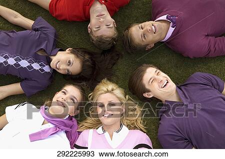 Group of friends lying in a golf course, Biltmore Golf Course, Coral Gables, Florida, USA View Large Photo Image Stock Image - Group of friends lying in a golf course, Biltmore Golf Course, Coral Gables, Florida, USA. Fotosearch