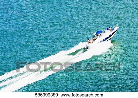 High angle view of a boat moving in the sea View Large Photo Image Stock Photo - High angle view of a boat moving in the sea. Fotosearch