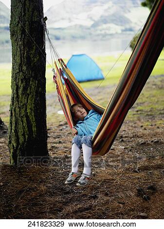Stock Photo - High angle view of a boy lying in a hammock. Fotosearch