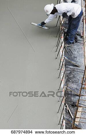 High angle view of a construction worker working at a construction site View Large Photo Image Picture - High angle view of a construction worker working at a construction site. Fotosearch