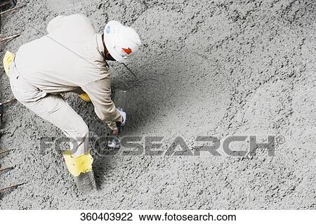 High angle view of a construction worker working at a construction site View Large Photo Image Stock Image - High angle view of a construction worker working at a construction site. Fotosearch