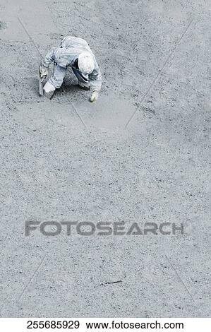 Stock Photo - High angle view of a construction worker working at a construction site. Fotosearch