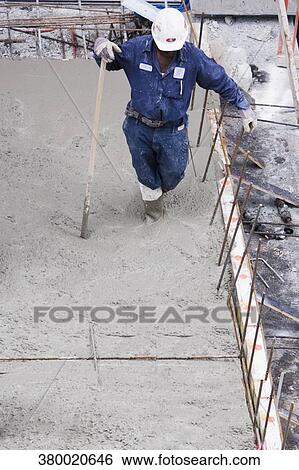 High angle view of a construction worker working at a construction site View Large Photo Image Stock Photograph - High angle view of a construction worker working at a construction site. Fotosearch