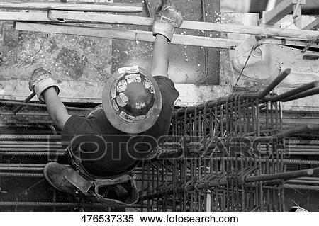 Stock Photography - High angle view of a construction worker working at a construction site. Fotosearch