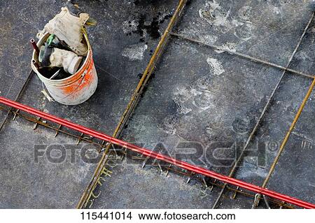 High angle view of a group of objects in a bucket at a construction site View Large Photo Image Picture - High angle view of a group of objects in a bucket at a construction site. Fotosearch