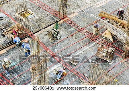 High angle view of a group of construction workers working at a construction site View Large Photo Image Stock Photography - High angle view of a group of construction workers working at a construction site. Fotosearch
