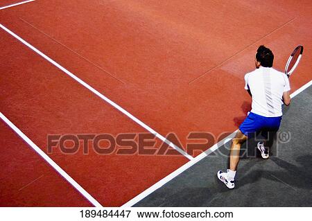 High angle view of a man playing tennis View Large Photo Image Stock Photo - High angle view of a man playing tennis. Fotosearch