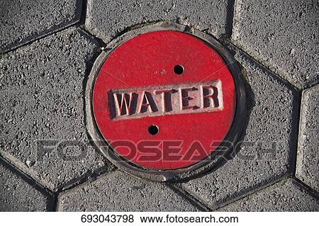 High angle view of a manhole in the street View Large Photo Image Stock Photo - High angle view of a manhole in the street. Fotosearch