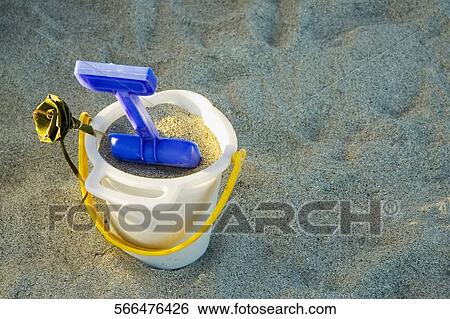 High angle view of a sand pail and a shovel on the beach View Large Photo Image Stock Photograph - High angle view of a sand pail and a shovel on the beach. Fotosearch