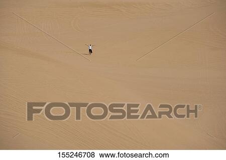 High angle view of a tourist in a desert, Coral Pink Sand Dunes State Park, Utah, USA View Large Photo Image Stock Photo - High angle view of a tourist in a desert, Coral Pink Sand Dunes State Park, Utah, USA. Fotosearch