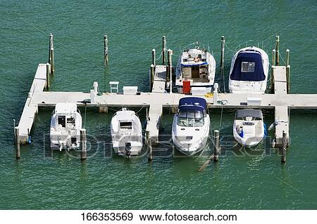 High angle view of boats docked at a dock View Large Photo Image Stock Photo - High angle view of boats docked at a dock. Fotosearch
