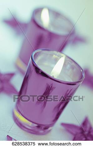 High angle view of lit candles in glasses View Large Photo Image Stock Photography - High angle view of lit candles in glasses. Fotosearch