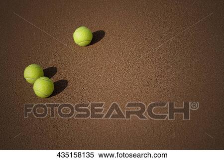 High angle view of three tennis balls in a court View Large Photo Image Stock Photography - High angle view of three tennis balls in a court. Fotosearch