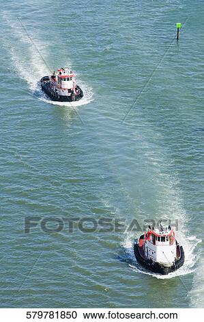 High angle view of two tour boats in water View Large Photo Image Stock Image - High angle view of two tour boats in water. Fotosearch