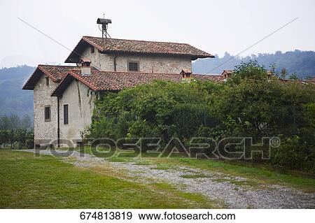 House at the roadside, Corte Franca, Brescia Province, Lombardy, Italy View Large Photo Image Stock Photo - House at the roadside, Corte Franca, Brescia Province, Lombardy, Italy. Fotosearch