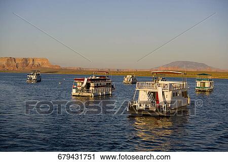 Stock Image - Houseboats in the lake, Glen Canyon Dam, Lake Powell, Colorado River, Page, Arizona, USA. Fotosearch