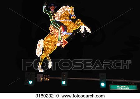 Lit up neon sign of an equestrian, Fremont Street, Las Vegas, Nevada, USA View Large Photo Image Stock Image - Lit up neon sign of an equestrian, Fremont Street, Las Vegas, Nevada, USA. Fotosearch