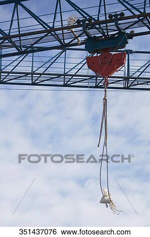 Low angle view of a bag hanging on a crane View Large Photo Image Stock Photograph - Low angle view of a bag hanging on a crane. Fotosearch