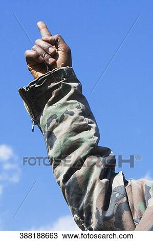 Stock Image - Low angle view of a person's hand pointing upwards. Fotosearch