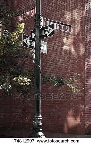 Low angle view of a street name sign View Large Photo Image Stock Photo - Low angle view of a street name sign. Fotosearch