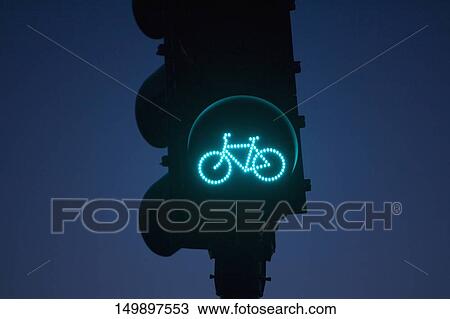 Stock Image - Low angle view of a traffic Signal for bicycles. Fotosearch