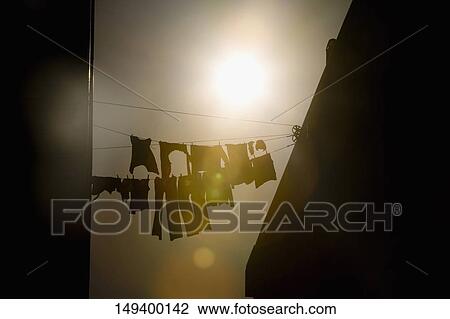 Stock Image - Low angle view of clothes drying on clotheslines, San Francisco, California, USA. Fotosearch