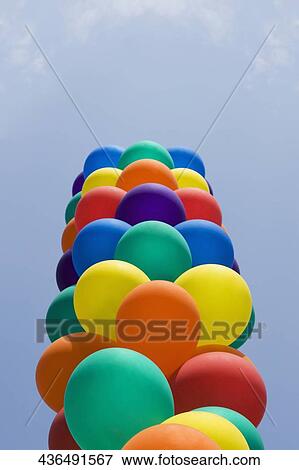 Stock Photo - Low angle view of colorful balloons in a gay pride parade, Washington DC, USA. Fotosearch