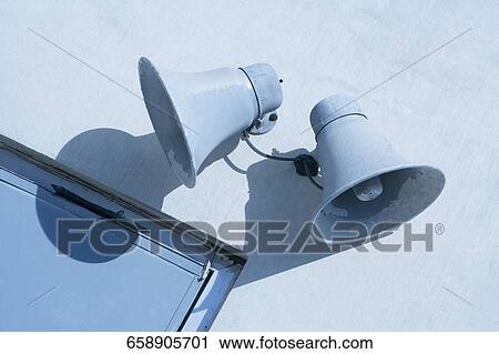 Low angle view of two megaphones on the wall View Large Photo Image Stock Image - Low angle view of two megaphones on the wall. Fotosearch