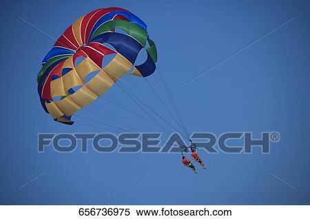 Stock Photography - Low angle view of two paragliders in the sky, Miami Beach, Florida, USA. Fotosearch