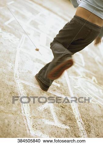 Low section view of a woman playing hopscotch View Large Photo Image Stock Image - Low section view of a woman playing hopscotch. Fotosearch