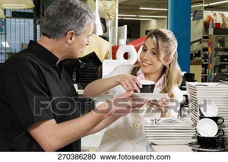 Man and his daughter buying crockery in a supermarket View Large Photo Image Stock Image - Man and his daughter buying crockery in a supermarket. Fotosearch