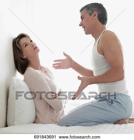 Stock Image - Man consoling a woman. Fotosearch