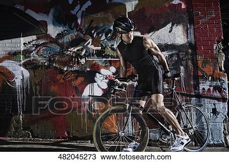 Man cycling in the street View Large Photo Image Stock Image - Man cycling in the street. Fotosearch