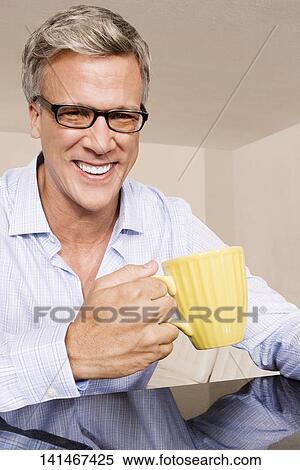 Man drinking coffee View Large Photo Image Stock Photography - Man drinking coffee. Fotosearch