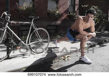 Man exercising in a street View Large Photo Image Picture - Man exercising in a street. Fotosearch