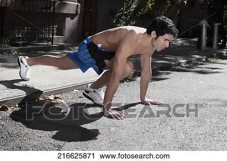Man exercising in a street View Large Photo Image Stock Image - Man exercising in a street. Fotosearch