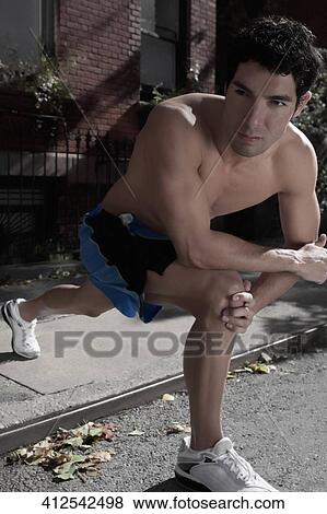 Man exercising in a street View Large Photo Image Stock Photo - Man exercising in a street. Fotosearch