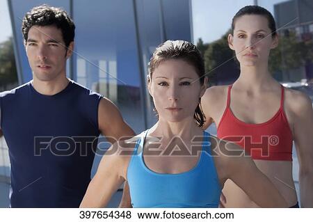 Man exercising with two women View Large Photo Image Stock Photo - Man exercising with two women. Fotosearch