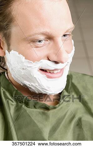 Man getting shaved in a salon View Large Photo Image Picture - Man getting shaved in a salon. Fotosearch