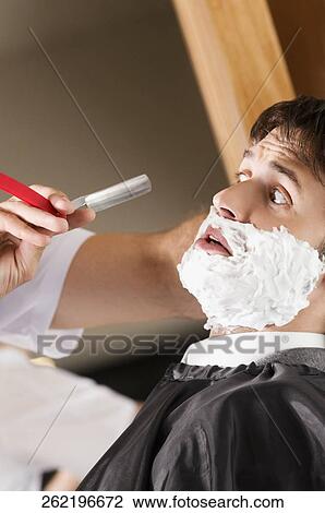 Man getting shaved in a salon View Large Photo Image Stock Image - Man getting shaved in a salon. Fotosearch