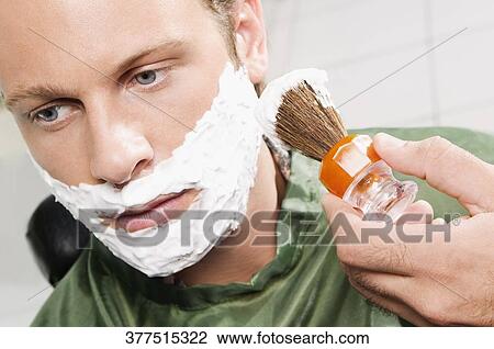 Man getting shaved in a salon View Large Photo Image Stock Image - Man getting shaved in a salon. Fotosearch
